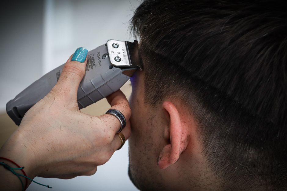 Barber apprentice training at a licensed barbershop